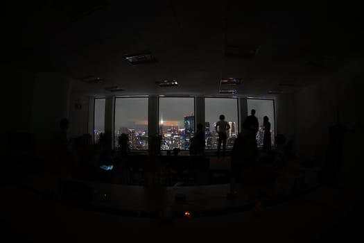 Silhouette of urban night view and people. Shooting Location: Tokyo metropolitan area