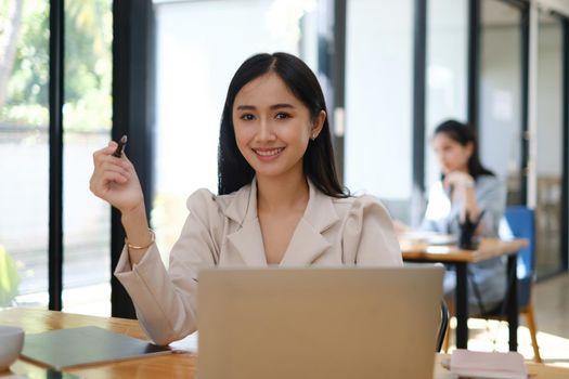 Asian accountant woman working audit budget and finance of company on wooden desk in office. consult, business, tax concept