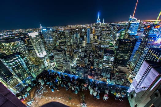 People looking at night view from Rockefeller Center Observatory (Top of the Rock) 6. Shooting Location: New York, Manhattan