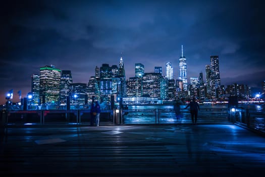 Night view and people of Manhattan and Brooklyn Bridge. Shooting Location: New York, Manhattan