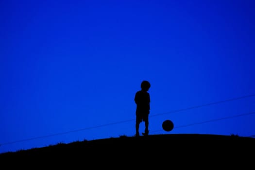 A boy playing with a soccer ball (with electric wire). Shooting Location: Tokyo Chofu City