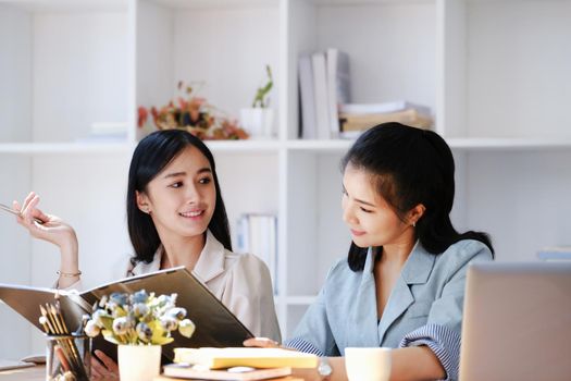 Consultation concept, contract signing, insurance, female employee holding a pen is offering contract documents to customers to sign important documents