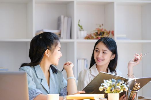 Consultation concept, contract signing, insurance, female employee holding a pen is offering contract documents to customers to sign important documents