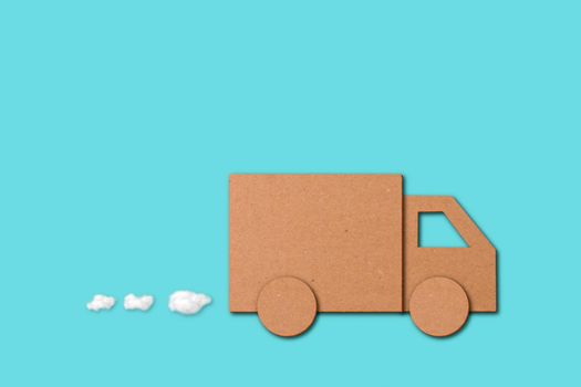 Small cutout of a van over a blue background in a concept of shopping, business deliveries and orders