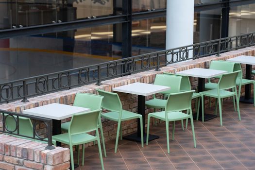 Interior of wooden table in food court shopping mall. Food center in department store.