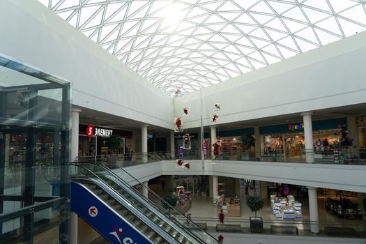 Grodno, Belarus - April 07, 2021: View on escalator in modern shopping mall Triniti