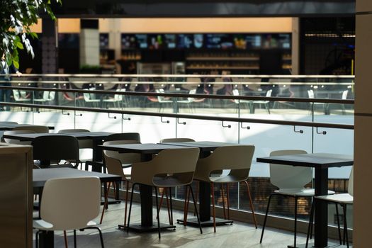 Interior of wooden table in food court shopping mall. Food center in department store.