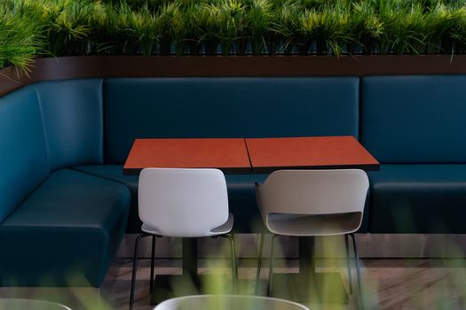 Food court area with spacious eating dining location decorated with grass. Modern design