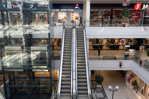 Grodno, Belarus - April 07, 2021: View on escalator in modern shopping mall Triniti