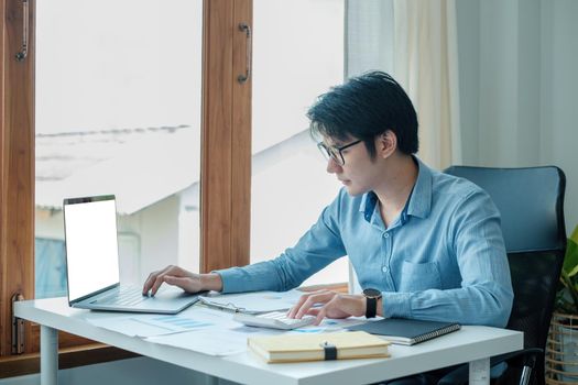 A professional male develops the account application by laptop computer