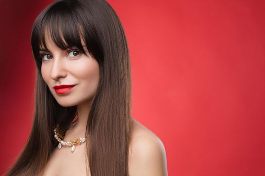 Beauty portrait of a young beautiful brunette girl with long black straight hair and wreath on it