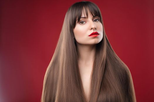 Beauty portrait of a young beautiful brunette girl with long black straight hair and wreath on it