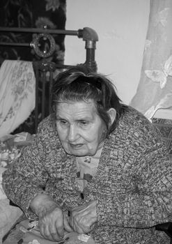 Rostov region, Russia, 2012-11-18, A very elderly woman is in her room. Old Age is a Russian village. In age. Portrait of an old grandmother. Village life.