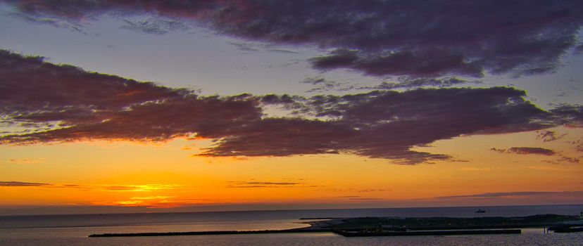Heligoland island - look on the island dune - sunrise over the sea - sun glow