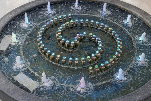 fountain with multicolored illumination close-up. photo