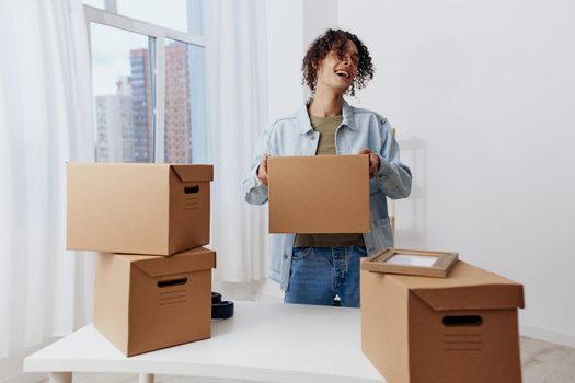portrait of a man unpacking with box in hand Lifestyle. High quality photo