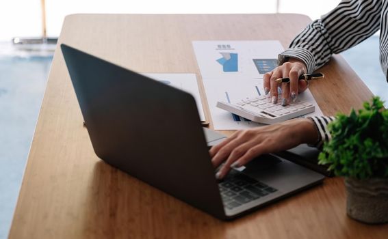 Accountant bookkeeper or financial inspector hands making report, calculating. Home finances, investment, economy, saving money or insurance concept.