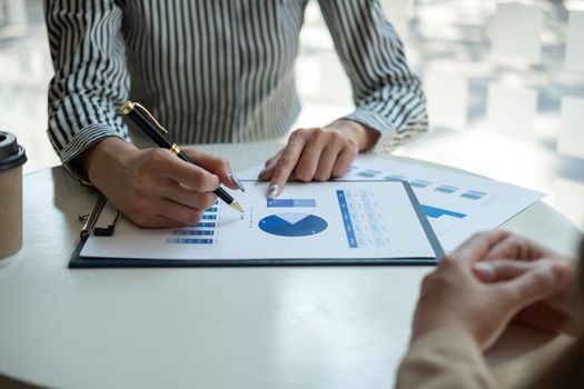 Close up Business people meeting to discuss the situation on the market. Business Financial Concept