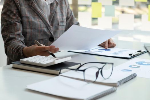 Accountant bookkeeper or financial inspector hands making report, calculating. Home finances, investment, economy, saving money or insurance concept.