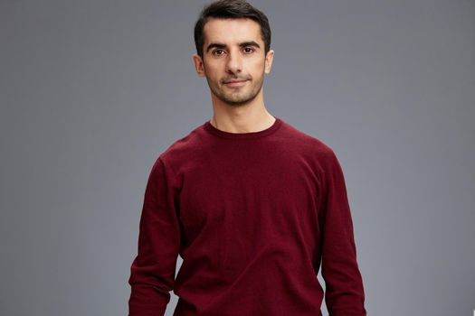 successful man in a sweater posing emotions elegant style isolated background. High quality photo