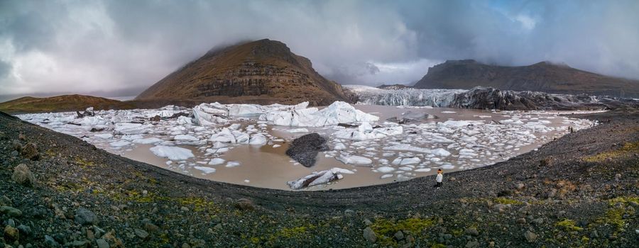 Glacier lake panorama with tourists and massive glaciars in the background, Iceland