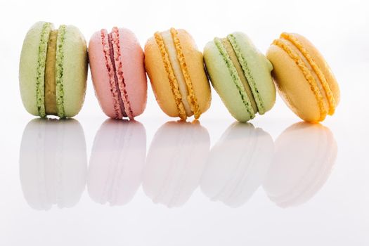 Tasty sweet color macaron. Colorful macarons dessert. French macarons on white background. Different colorful macaroon.