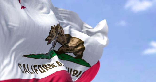 The California Republic flag with the grizzly bear Monarch waving in the wind. Patriotism and freedom. American state of California