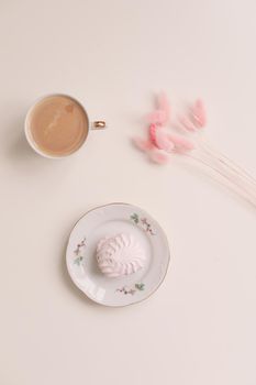 Good morning banner. Cup of coffee and homemade dessert zephyr. Top view. Food Photography with copy space. A cup of coffee and an airy marshmallow. Culinary background.