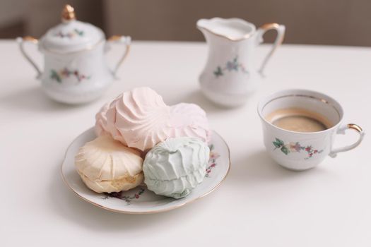 Good morning banner. Cup of coffee and homemade dessert zephyr. Top view. Food Photography with copy space. A cup of coffee and an airy marshmallow. Culinary background.