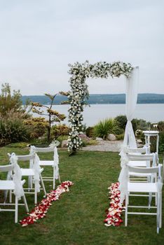 wedding ceremony in the woods among the trees on the green track