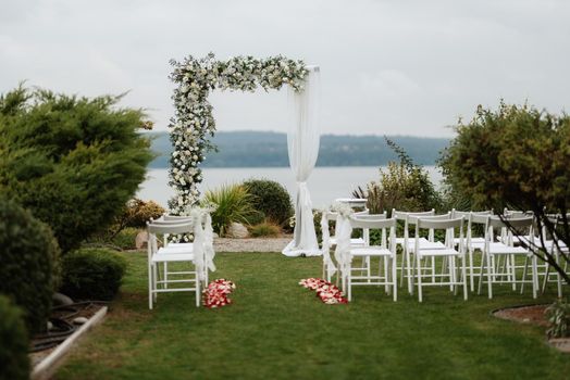 wedding ceremony in the woods among the trees on the green track