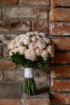 elegant wedding bouquet of fresh natural flowers and greenery