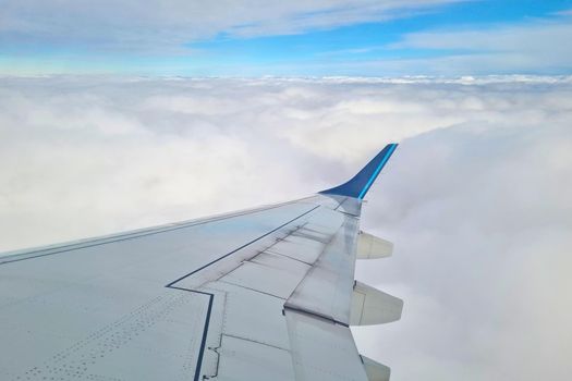 beautiful view of the clouds from the window of the flying plane