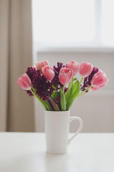 pink tulip bouquet in daylight. Spring stll life, birthday, Easter concept.