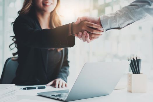 Business partnership meeting concept. Image business women handshake. Successful business people handshaking after good deal. Group support concept