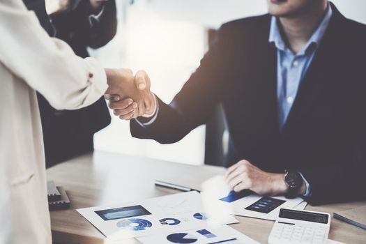 Business partnership meeting concept. Image business women handshake. Successful business people handshaking after good deal. Group support concept