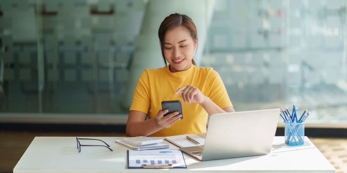 A businesswoman completes KYC using an online banking program in order to open a digital savings account. The definition of cyber security