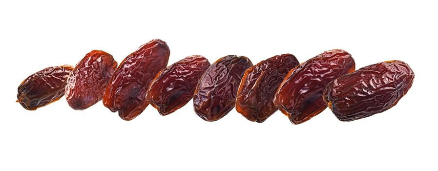 Dried dates levitate on a white background.