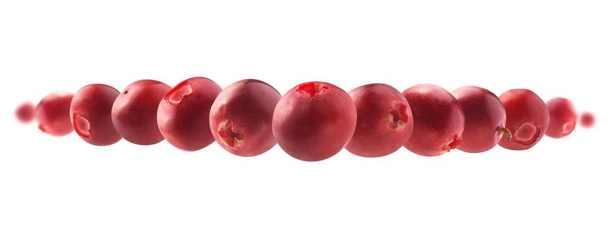 Red cranberry berries levitate on a white background.