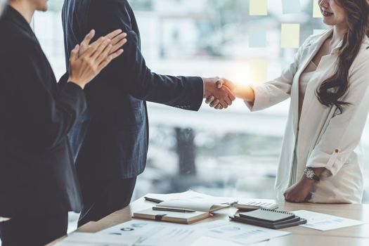 Business partnership meeting concept. Image business women handshake. Successful business people handshaking after good deal. Group support concept