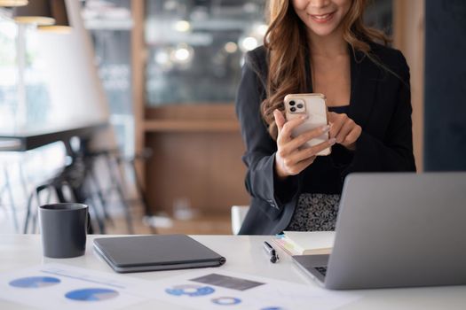 A businesswoman completes KYC using an online banking program in order to open a digital savings account. The definition of cyber security