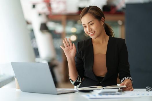 Job interview concept. Business woman questioning and listen to candidate answers during interview by video call on laptop