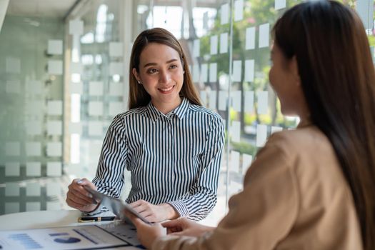 Two Asian Business woman working together. Business Financial concept