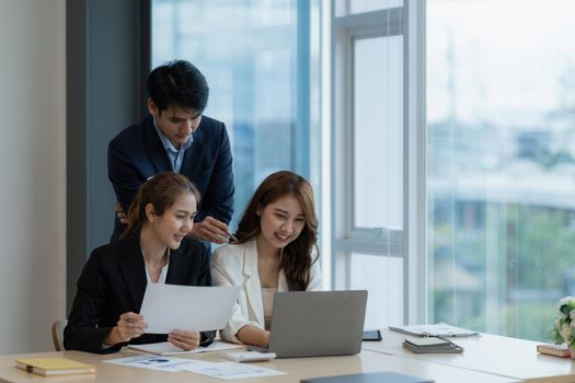 Business People Meeting to discuss and brainstorming the financial report paperwork in home office. Financial advisor teamwork and accounting concept