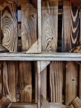 Stack of vintage wooden crates in a shelf for sale in a shop