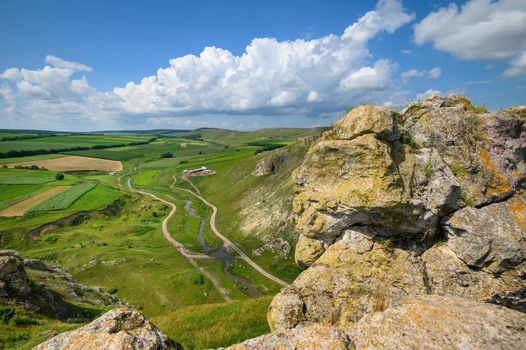 View to limestone toltres, rock residues of ancient coral reefs of dried Sarmatian sea at the North of Moldova