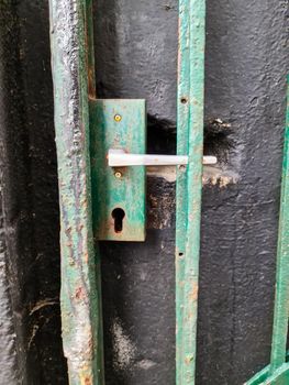 Close up of a metal lock at a closed Door