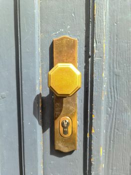 Close up of a metal lock at a closed Door