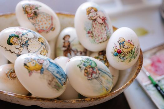 Beautiful Easter goose eggs on the plate. Decorated and painted eggs for festival. Home made print