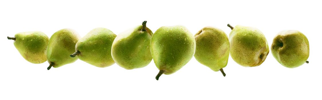 Green pears levitate on a white background.
